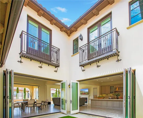 Internal courtyard access through bifold doors off kitchen and dining spaces