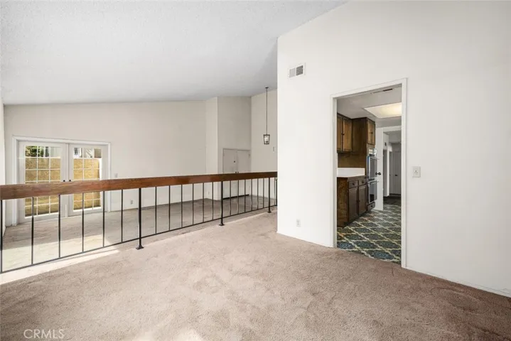 Dining room overlooks sunken living room.