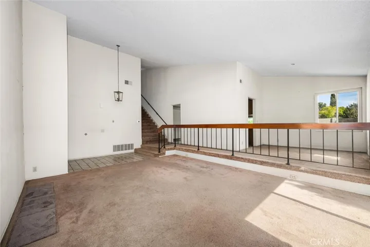 Large living room with vaulted ceilings.