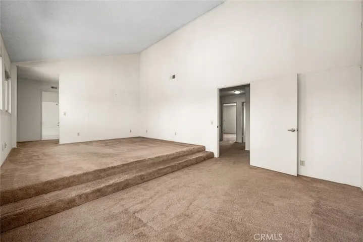 Vaulted ceilings in primary bedroom.