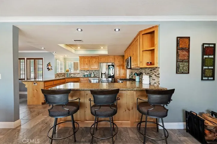 Kitchen with Granite Counters and tile Backsplash