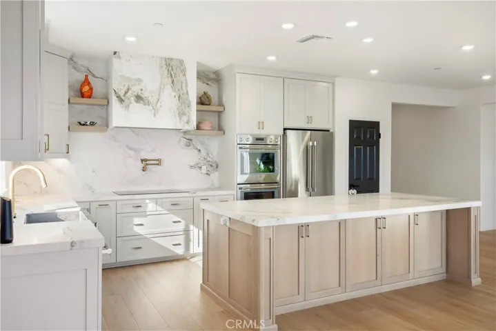 Upgraded Kitchen with Calcutta Honed Marble and Thermador Appliances