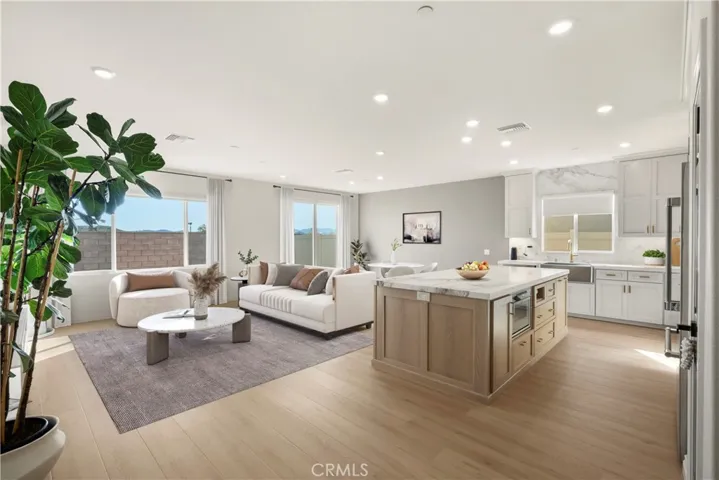 Great Room - showing family room, dining area and kitchen - Virtually Staged.