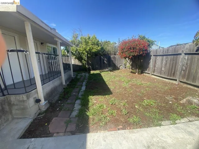 View of fenced backyard