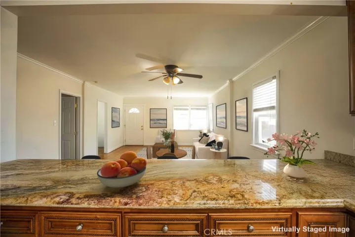 Kitchen opens to dining and living areas.