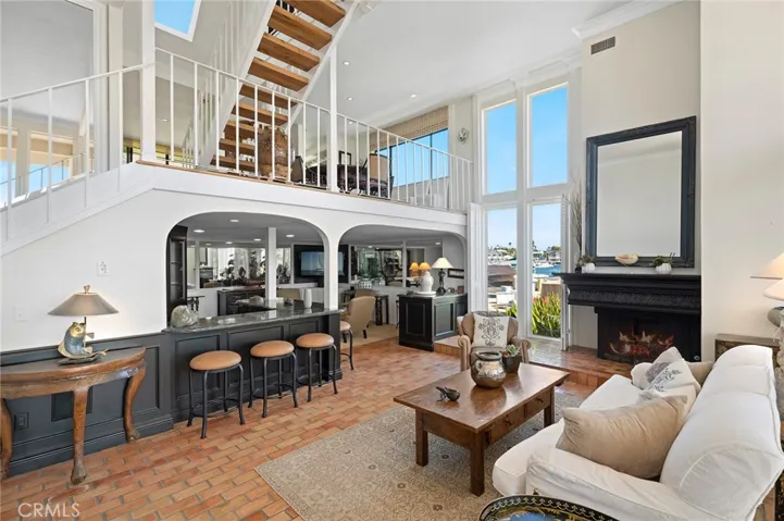 Living Room view to Den with bar seating