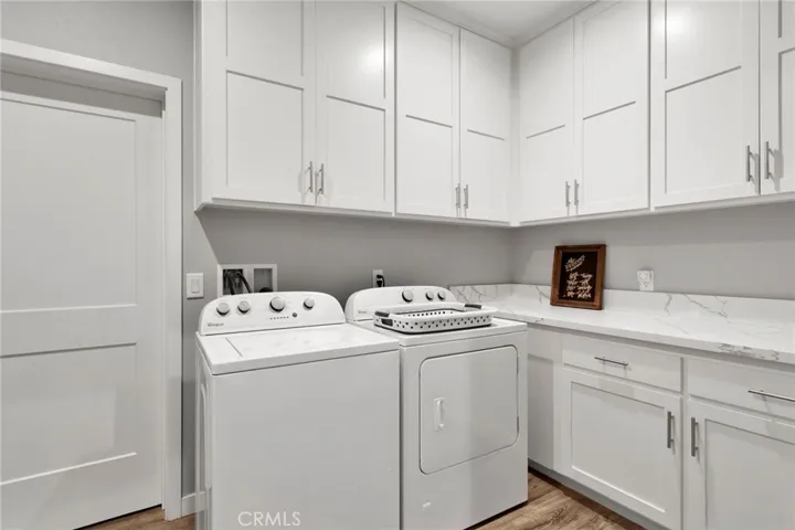 Laundryroom with counter and storage galore!