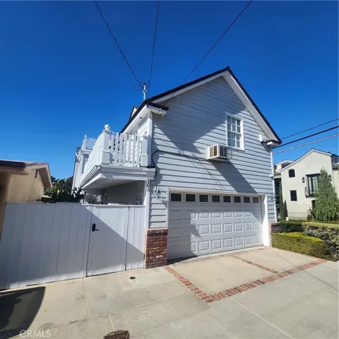 Private secured entry from the alley includes two car garage.
