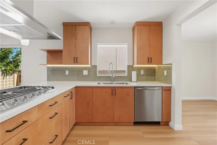 Kitchen window with built in dishwasher and cooktop.