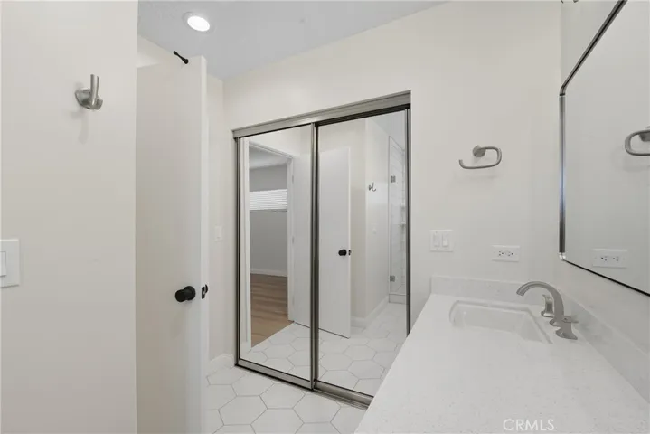 Master-suite bathroom with closet.