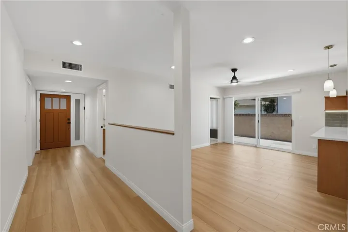 View of entrance and family room from the hallway.