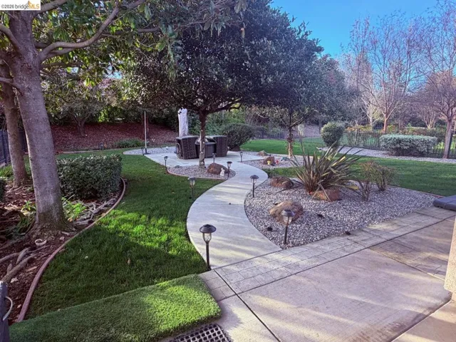View of home's community with a patio area
