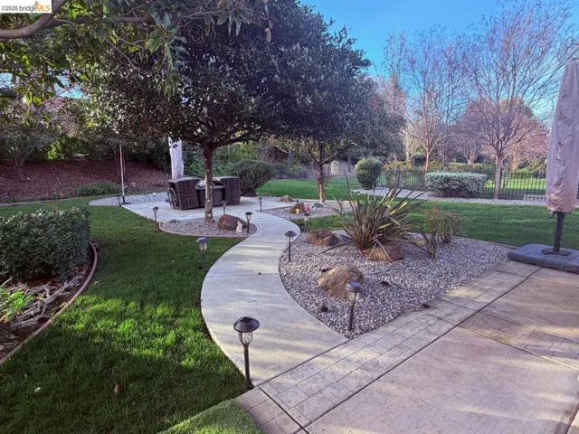 View of home's community with a patio area