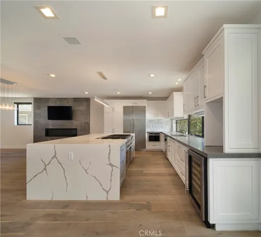 SPACIOUS KITCHEN OPENS TO LIVING & DINING ROOM AREA