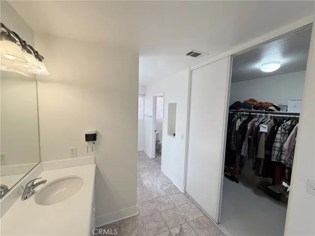 primary bath features walk in closet...