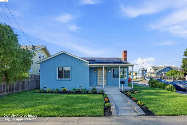 View of front of house with roof mounted solar panels, stucco siding, a chimney, a porch, and a residential view