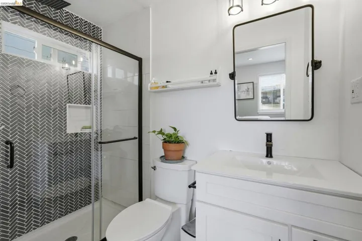 Full bathroom featuring a shower stall and vanity