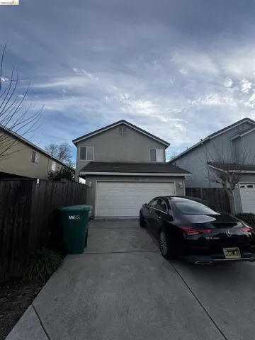 Garage featuring concrete driveway