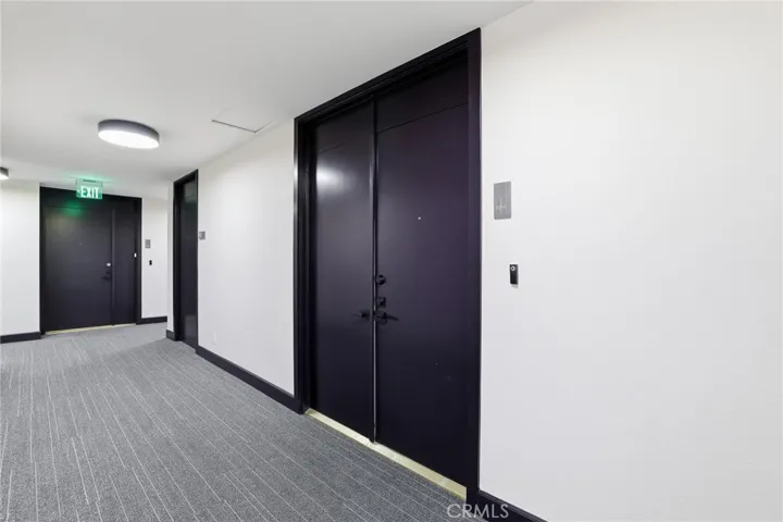 Remolded hallways to double door entrance to unit.