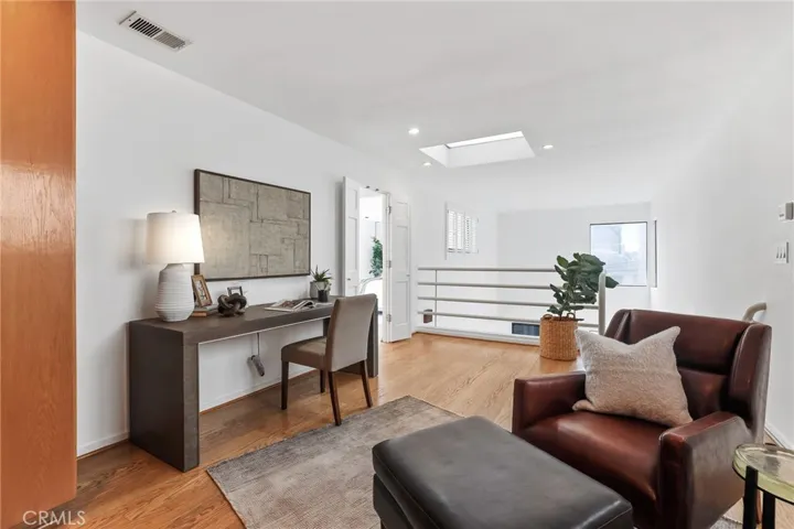Unit #66 - Second level loft showing double entry door to primary suite.