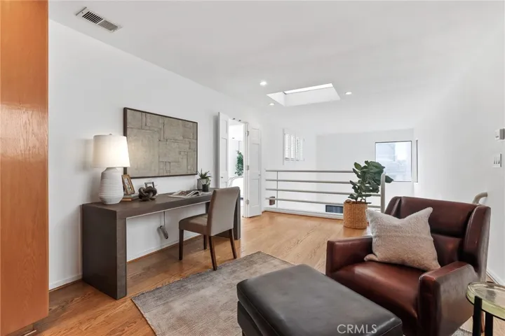 Unit #66 - Second level loft showing double entry door to primary suite.