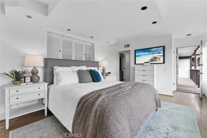 Unit #66 - Primary Suite new paint, refinished flooring and access to second level balcony with stairs to the rooftop deck.