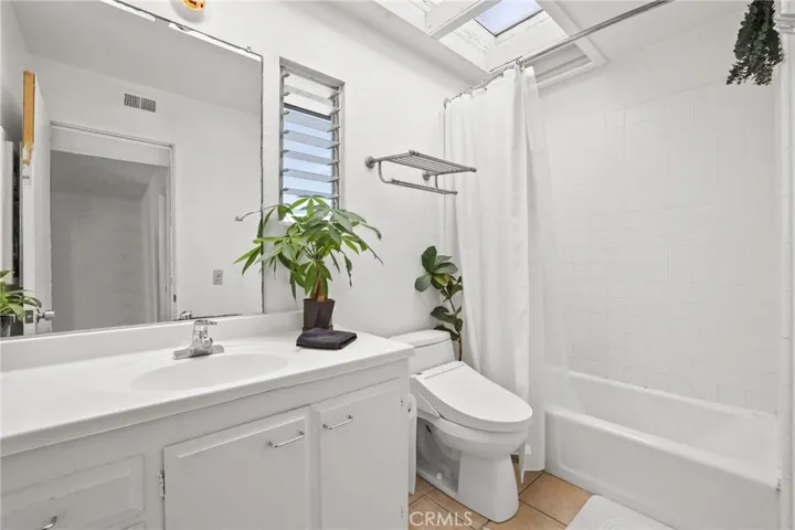 Unit #64 - Hallway bathroom has shower/tub combo