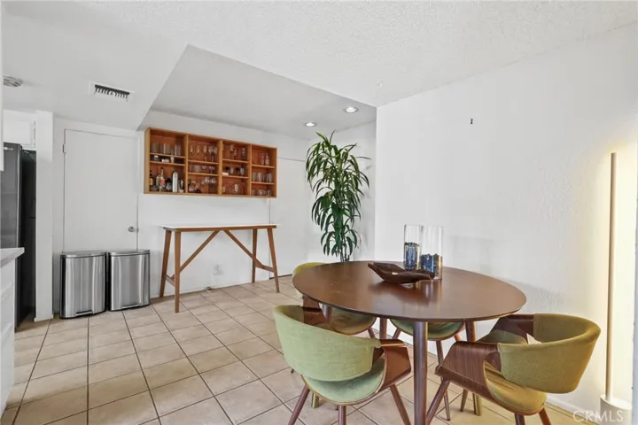 Unit #64 - Kitchen eating area has tile flooring.
