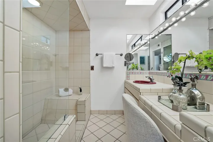 Unit #66 - Primary En Suite has oversized walk-in tile shower.