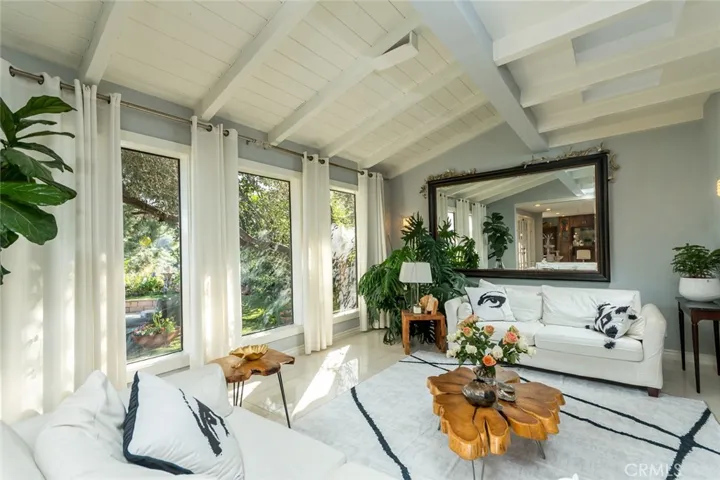 living room sitting area with garden views
