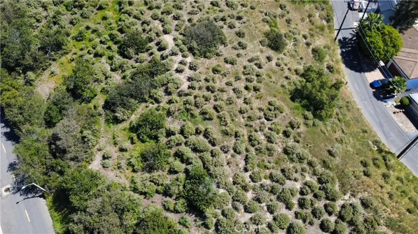 Closer aerial detail capturing the character of the land, with natural vegetation and contours that contribute to privacy and design potential.