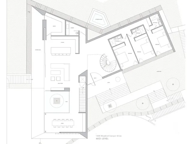 The main living level is designed for both everyday living and elevated entertaining, featuring an open-concept kitchen, dining, and family room that seamlessly connect to outdoor spaces. A central courtyard element introduces natural light and a calming focal point, while the bedroom wing offers privacy and separation. The layout creates a balanced flow between social and private spaces, all oriented to maximize light, air, and the surrounding coastal setting.