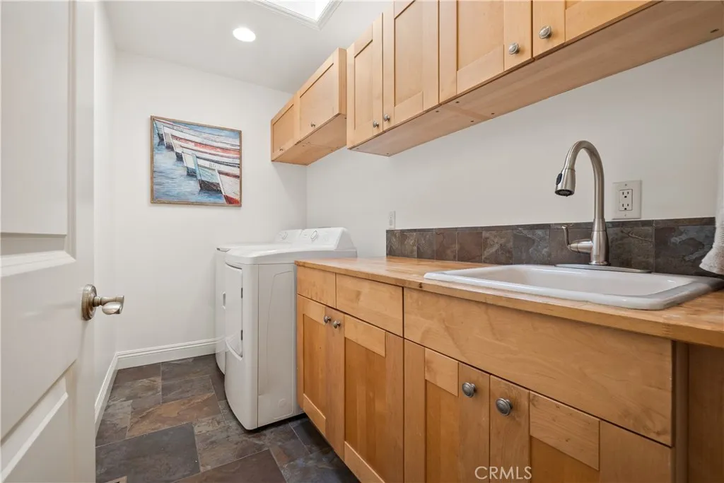 The laundry room is conveniently located onto the bedroom level.