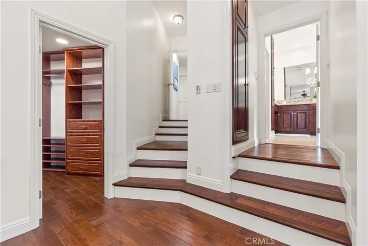 Well-appointed primary suite featuring a large walk-in closet and a serene, spa-like bath designed for relaxation.