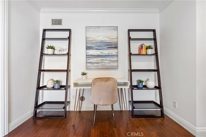 Spacious and versatile family room featuring plantation shutters, recessed lighting, and direct access to the backyard. The adjoining bonus room provides flexible space for a home office, guest room, studio, or study area, complemented by a full bath for added convenience.