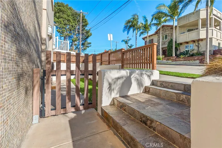 The front entry to the home is bright and welcoming. A perfect spot to enjoy the neighborhood.