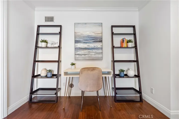 Spacious and versatile family room featuring plantation shutters, recessed lighting, and direct access to the backyard. The adjoining bonus room provides flexible space for a home office, guest room, studio, or study area, complemented by a full bath for added convenience.