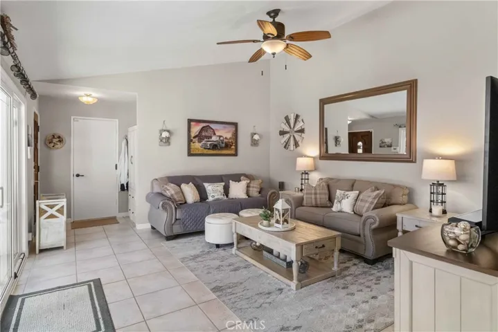 Spacious living room with slider leading to courtyard