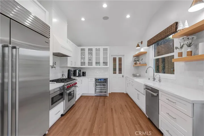 KITCHEN WITH TOP OF THE LINE APPLIANCES AND ENTRY TO THE WALK IN PANTRY