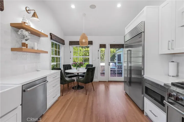 KITCHEN WITH THE CUSTOM CABINETRY AND BREAKFAST NOOK
