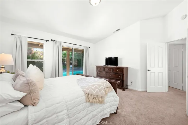 Primary Bedroom with en suite bathroom and direct access to pool