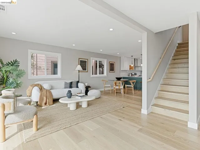 Living room featuring light wood-style floors and recessed lighting