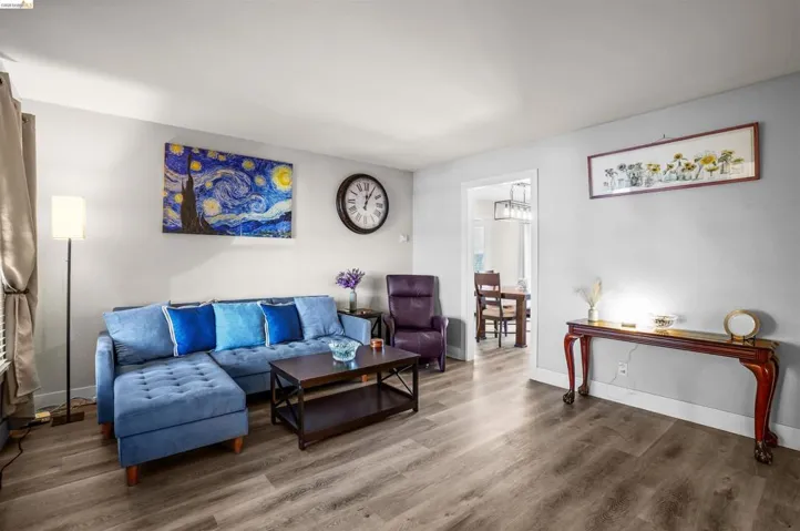 Living area featuring wood finished floors and baseboards