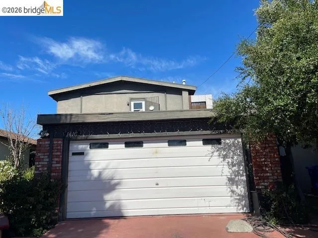 Garage featuring driveway