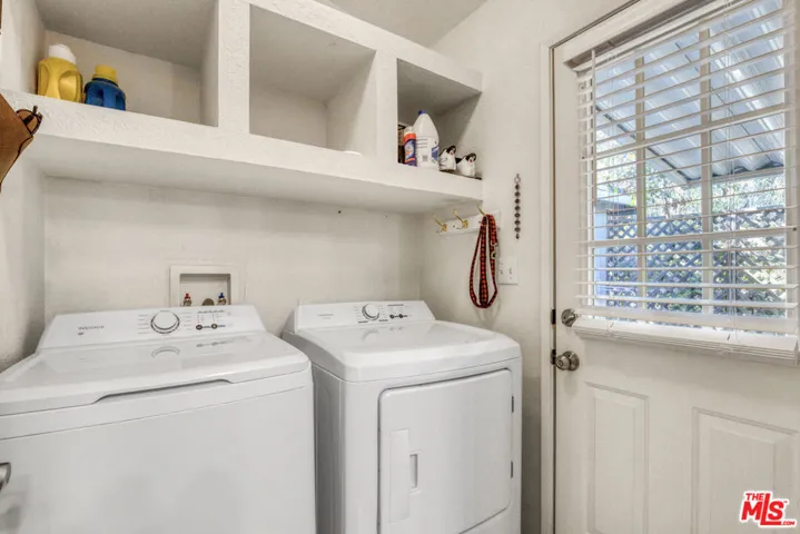 Laundry room with door leading