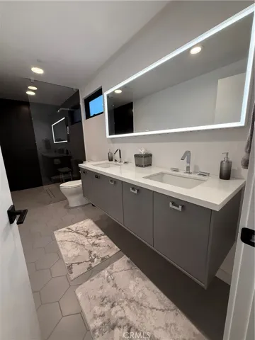 First floor full bath with double sinks next to room #1
