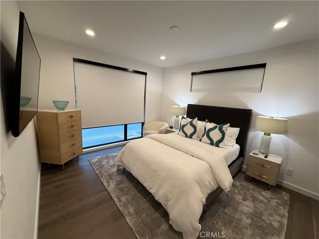 Main floor bedroom #2 with Queen bed and 50 " TV