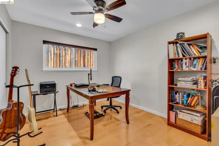 Office area featuring ceiling fan, light wood-style floors, and recessed lighting