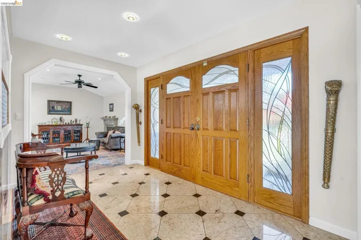 Entrance foyer featuring a ceiling fan, recessed lighting, and vaulted ceiling