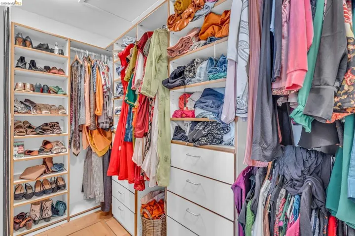 Walk in closet featuring attic access